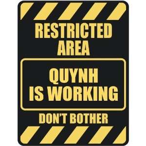   RESTRICTED AREA QUYNH IS WORKING  PARKING SIGN