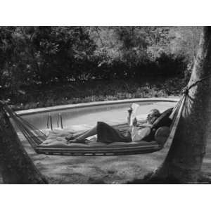  Greer Garson Reading While Relaxing in a Hammock Near Her 