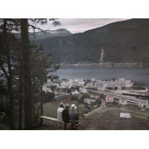  Three Vacationers Rest on a Bench Overlooking Aandalsnes 