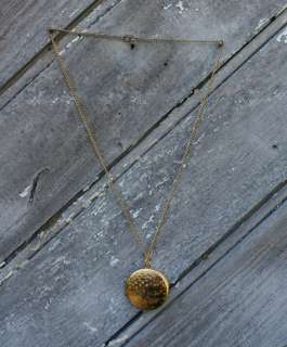 Here we have an Adorable Gold Tone Vintage Circle Locket Necklace 