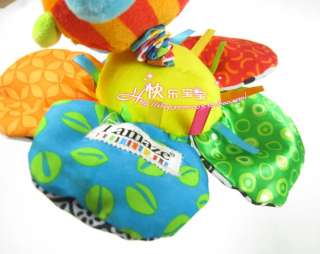 Soft body and head; teether rings around neck; colorful ribbons, knots
