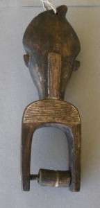 Large beautifully carved Baule heddle pulley with expressive male face 