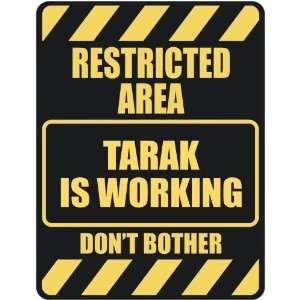   RESTRICTED AREA TARAK IS WORKING  PARKING SIGN