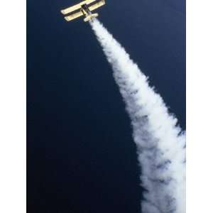  View from Above a Biplane in Flight, Spewing White Smoke 