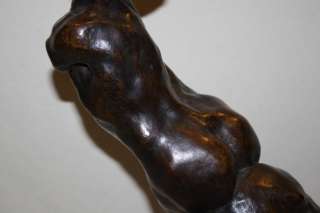 BRONZE SCULPTURE MAN SITTING TO THE SIDE SIGNED NOCQUER  
