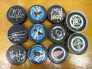 LOT of 11 hockey pucks Autographed  