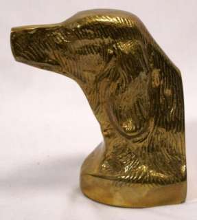 This is a pair of solid brass bookends in the shape of dog heads 