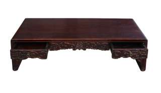   this kang low coffee table has the traditional chinese scroll legs