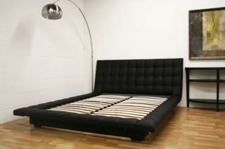 the contemporary design of this padded upholstered platform bed helps 