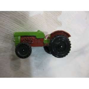  Green Tractor With Red Fenders Pulling A Red Tiller 